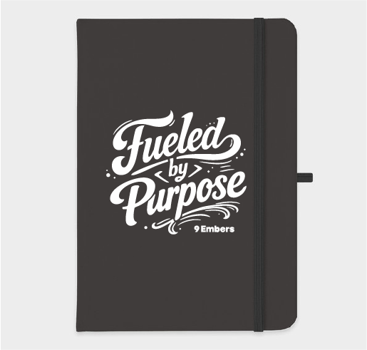 Dark journal with Fueled by Purpose in expressive white lettering and the 9 Embers wordmark on its cover.